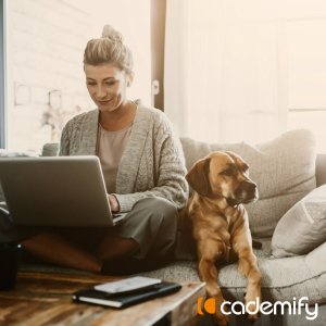 woman working from home with her dog on the sofa